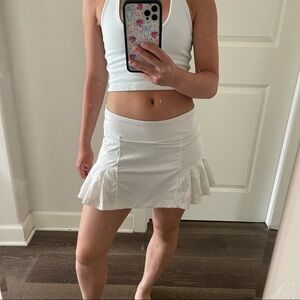 Head white pleated mini tennis skirt
